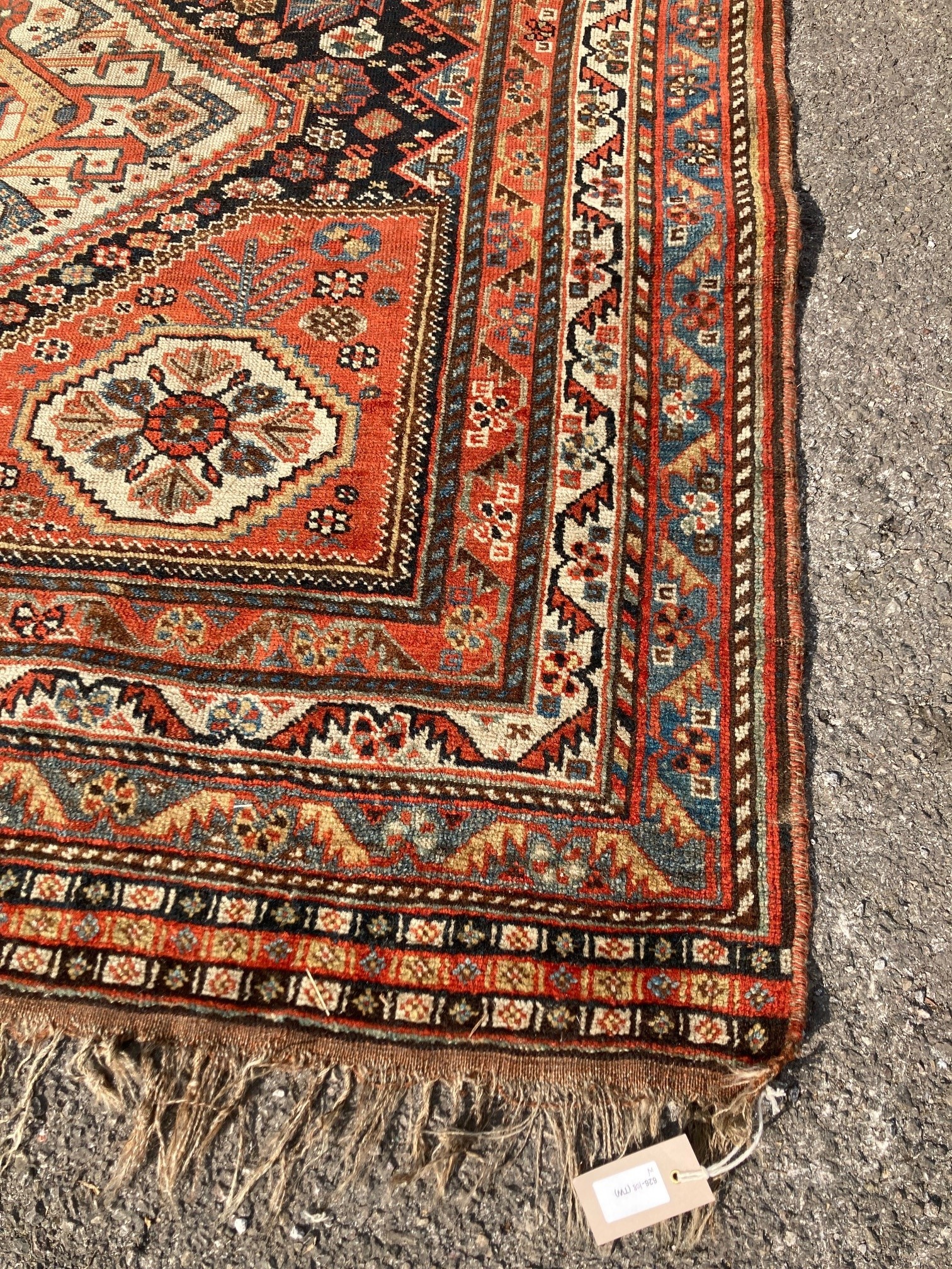 An early 20th century Persian blue ground rug, having three central medallions and floral decoration, 250 x 146cm